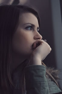 woman looking out window